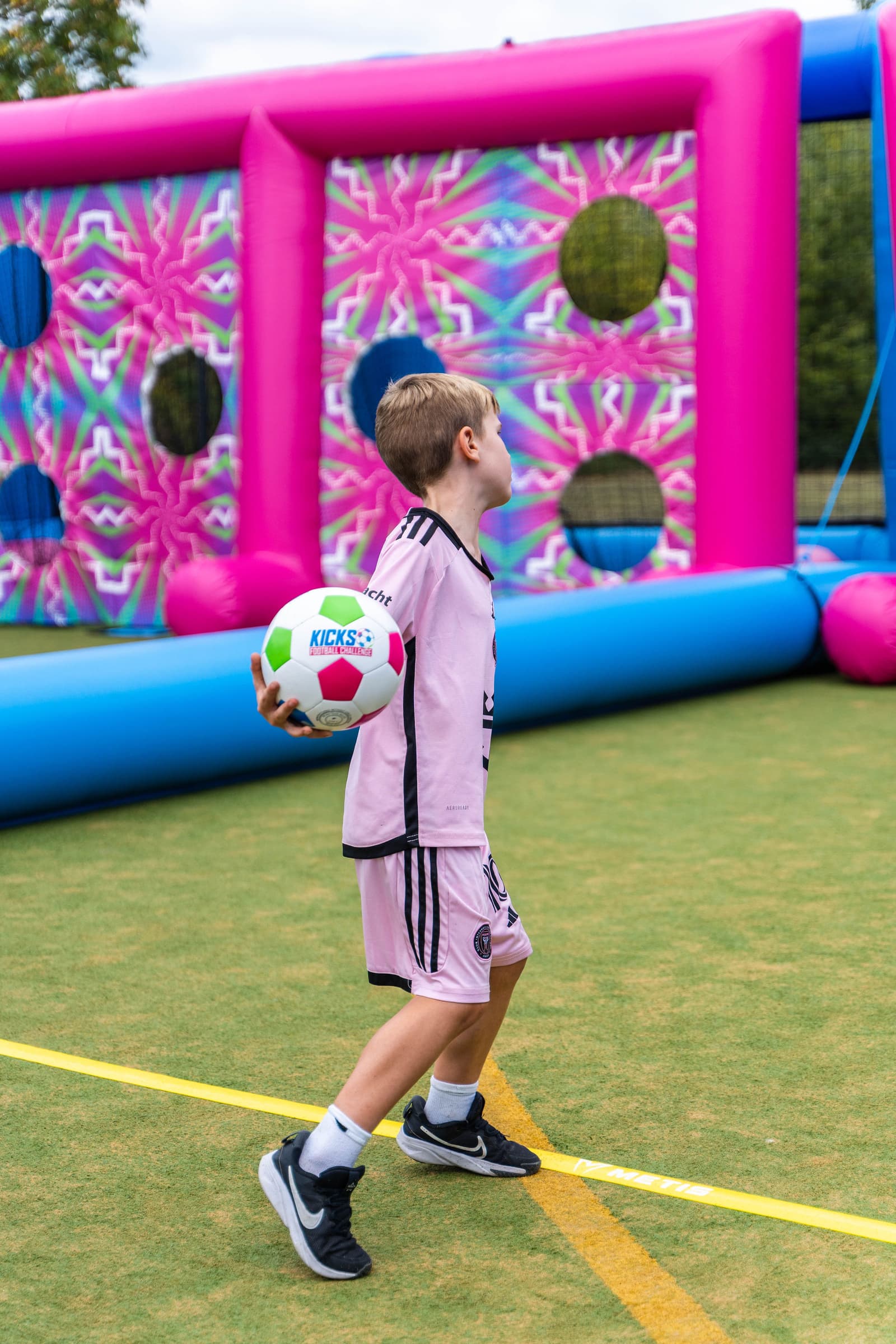 Family playing football challenge